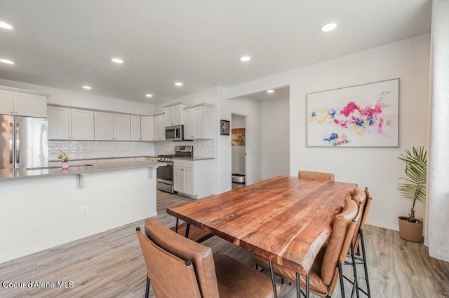 16171 N Hadley Loop, Rathdrum, ID 83858 - dining space with light wood-type flooring, recessed lighting, and baseboards