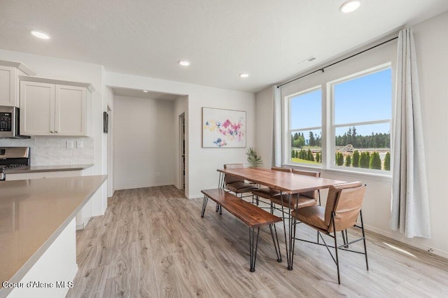 16171 N Hadley Loop, Rathdrum, ID 83858 - dining area featuring light wood finished floors, recessed lighting, and baseboards