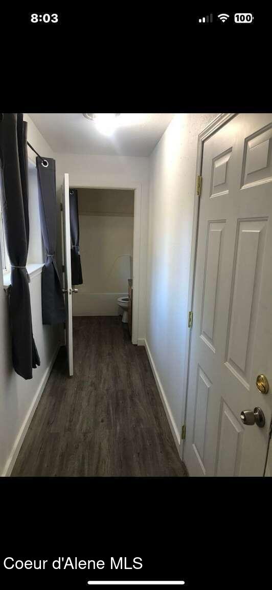 243 Pine St, Moyie Springs, ID 83845 - hallway featuring wood finished floors and baseboards