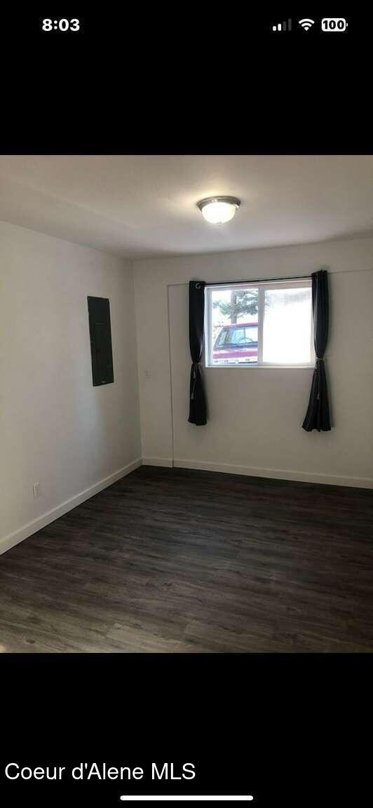 243 Pine St, Moyie Springs, ID 83845 - unfurnished room featuring dark wood-style flooring and baseboards