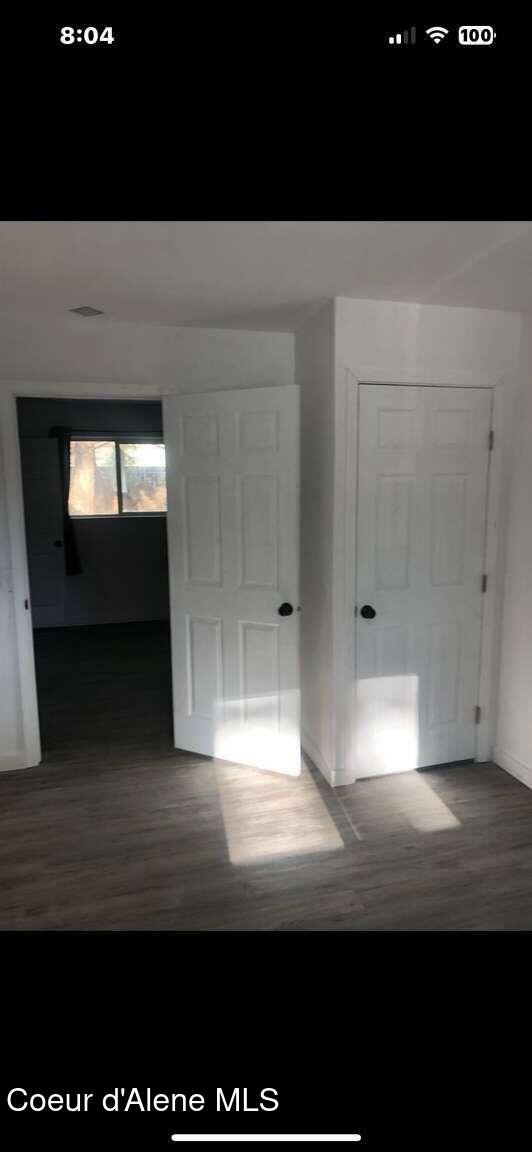 243 Pine St, Moyie Springs, ID 83845 - hallway featuring wood finished floors and baseboards