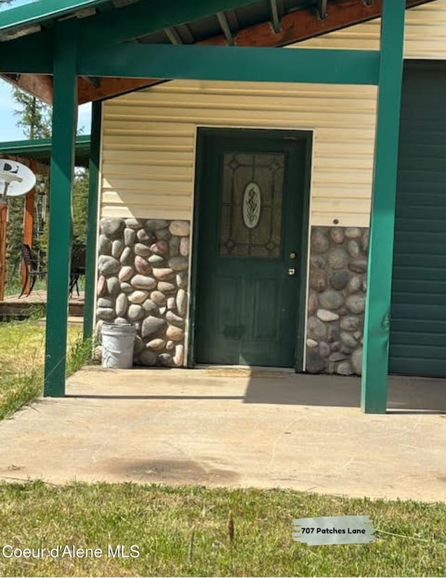 707 Patches Ln, Saint Maries, ID 83861 - doorway to property featuring stone siding