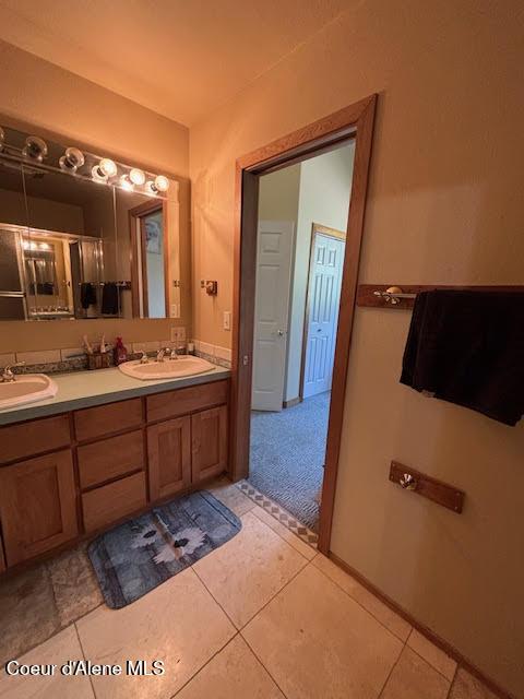 707 Patches Ln, Saint Maries, ID 83861 - full bath featuring double vanity and tile patterned floors