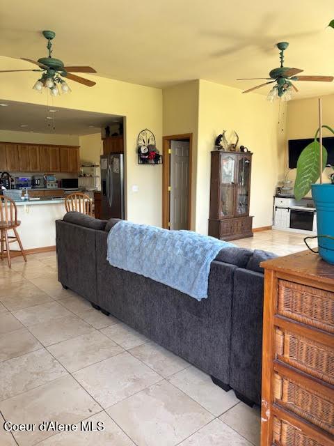 707 Patches Ln, Saint Maries, ID 83861 - living room featuring a ceiling fan and light tile patterned floors