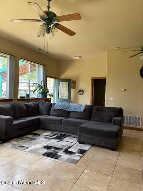 707 Patches Ln, Saint Maries, ID 83861 - living area with ceiling fan and light tile patterned floors