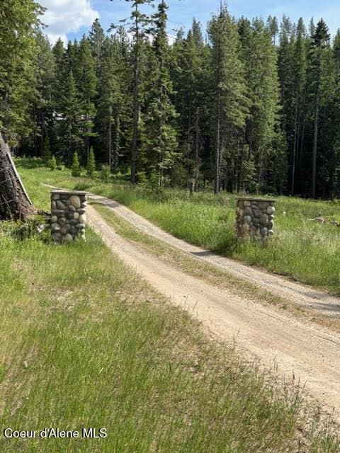 707 Patches Ln, Saint Maries, ID 83861 - view of dirt / gravel road featuring a wooded view