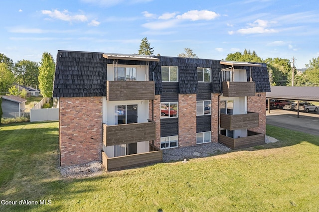 107 E Hattie Ave, Coeur Dalene, ID 83814 - rear view of house featuring brick siding and mansard roof