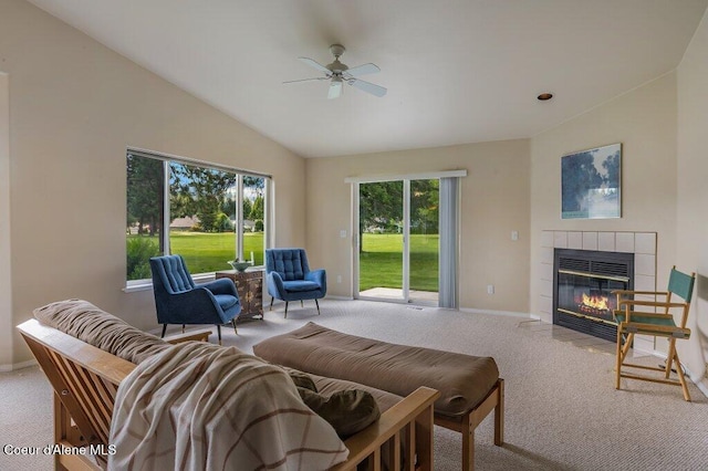 21013 N Circle Rd, Rathdrum, ID 83858 - carpeted living area featuring vaulted ceiling, a ceiling fan, baseboards, and a fireplace