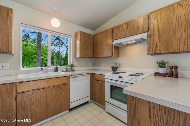 21013 N Circle Rd, Rathdrum, ID 83858 - kitchen with white appliances, vaulted ceiling, a sink, under cabinet range hood, and light countertops