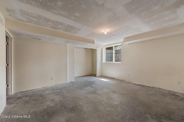 21013 N Circle Rd, Rathdrum, ID 83858 - unfurnished room with concrete floors and a textured ceiling