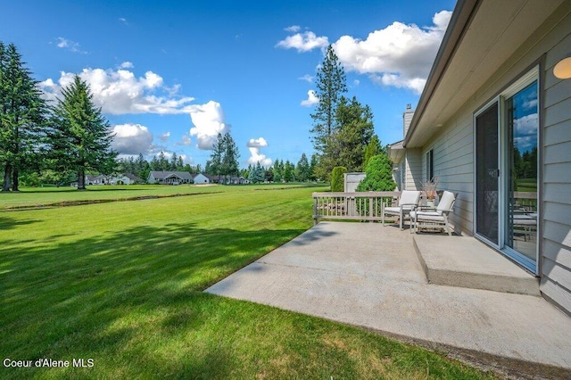 21013 N Circle Rd, Rathdrum, ID 83858 - view of grassy yard featuring a patio