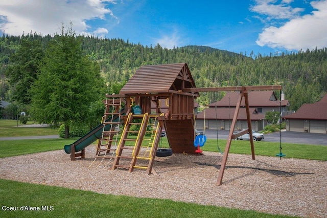 21013 N Circle Rd, Rathdrum, ID 83858 - community jungle gym with a wooded view, a lawn, and a mountain view