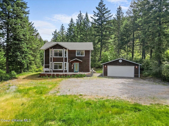 596 Overlake View Rd, Cocolalla, ID 83813 - view of front facade featuring an outbuilding, a detached garage, and a wooded view