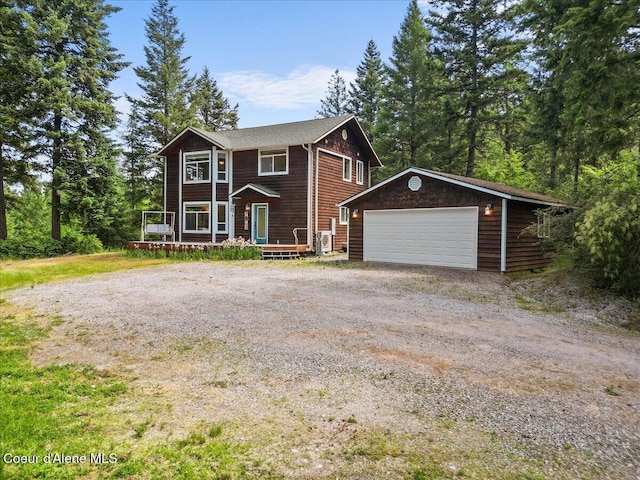 596 Overlake View Rd, Cocolalla, ID 83813 - view of front of house with an outbuilding, a garage, and a wooden deck