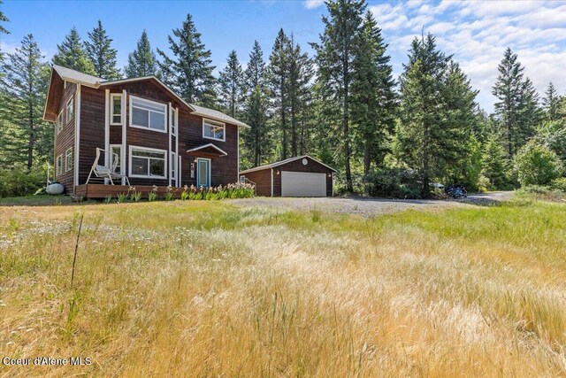 596 Overlake View Rd, Cocolalla, ID 83813 - view of front of home featuring an outbuilding and a garage