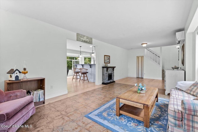 596 Overlake View Rd, Cocolalla, ID 83813 - living room with a wall mounted air conditioner, stairs, and a fireplace