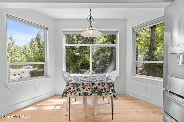 596 Overlake View Rd, Cocolalla, ID 83813 - dining area with healthy amount of natural light and light wood-style flooring
