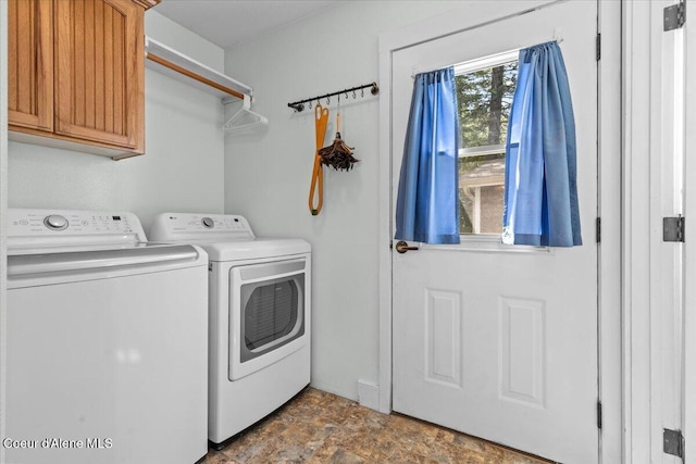 596 Overlake View Rd, Cocolalla, ID 83813 - laundry area with cabinet space, separate washer and dryer, and stone finish floors