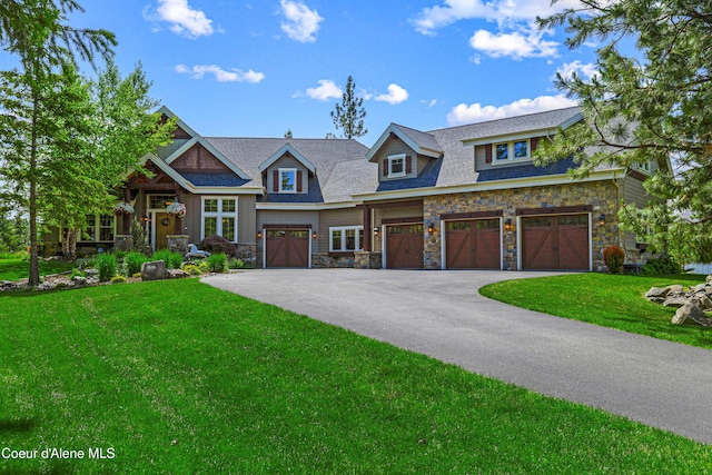 3857 E Beckon Ridge Rd, Coeur Dalene, ID 83814 - craftsman inspired home with stone siding, driveway, a garage, and a front lawn