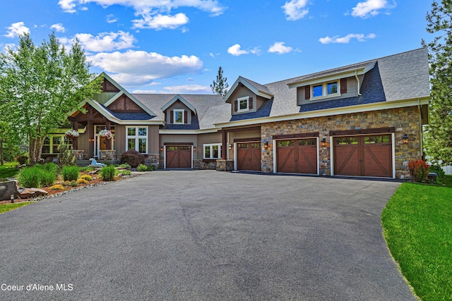 3857 E Beckon Ridge Rd, Coeur Dalene, ID 83814 - craftsman-style house with stone siding, driveway, and a garage