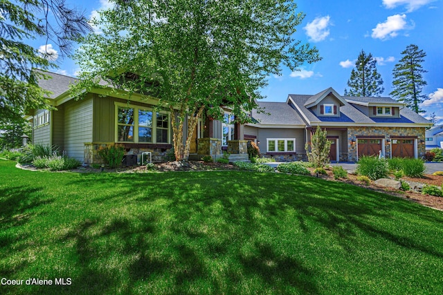 3857 E Beckon Ridge Rd, Coeur Dalene, ID 83814 - craftsman-style home with stone siding, a front lawn, and a garage