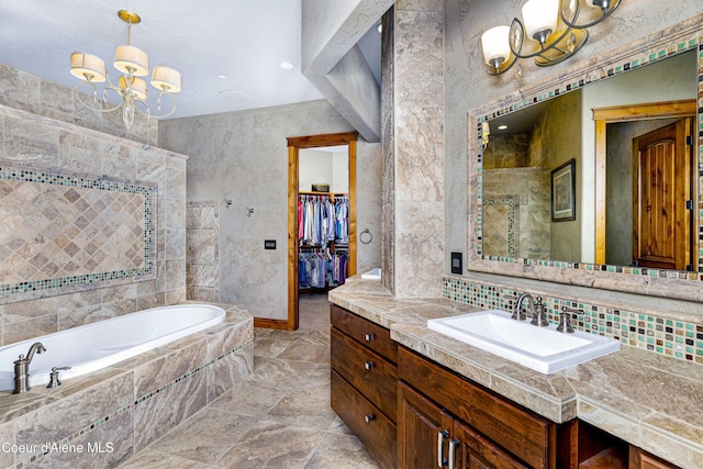 3857 E Beckon Ridge Rd, Coeur Dalene, ID 83814 - full bath featuring vanity, a garden tub, a chandelier, a walk in closet, and recessed lighting