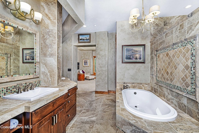 3857 E Beckon Ridge Rd, Coeur Dalene, ID 83814 - full bathroom with a chandelier, vanity, and a garden tub