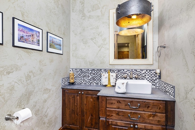 3857 E Beckon Ridge Rd, Coeur Dalene, ID 83814 - bathroom with vanity and backsplash