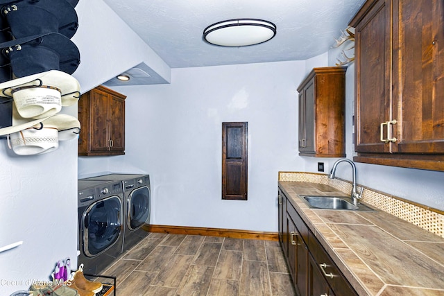 3857 E Beckon Ridge Rd, Coeur Dalene, ID 83814 - laundry area with cabinet space, separate washer and dryer, and wood tiled floors