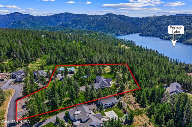 3857 E Beckon Ridge Rd, Coeur Dalene, ID 83814 - aerial view of residential area featuring a water and mountain view and property boundaries highlighted