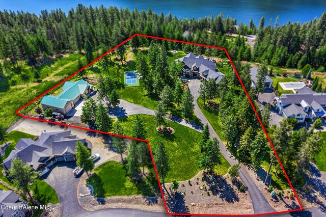 3857 E Beckon Ridge Rd, Coeur Dalene, ID 83814 - aerial perspective of suburban area with a heavily wooded area and property boundaries highlighted