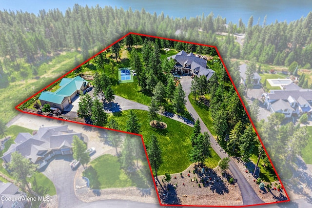 3857 E Beckon Ridge Rd, Coeur Dalene, ID 83814 - aerial perspective of suburban area featuring property parcel outlined and a forest