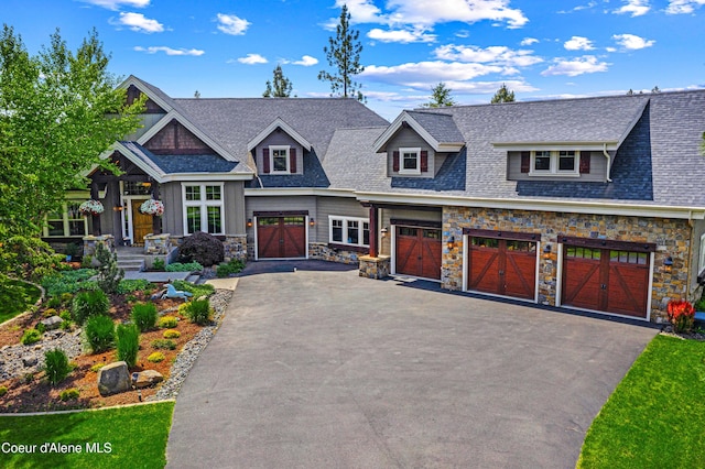3857 E Beckon Ridge Rd, Coeur Dalene, ID 83814 - craftsman-style house with driveway, stone siding, a garage, and a shingled roof