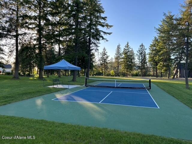 3857 E Beckon Ridge Rd, Coeur Dalene, ID 83814 - view of tennis court with a yard