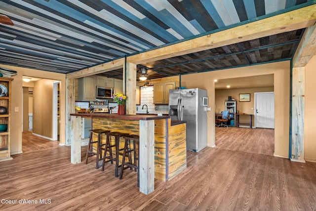 312 E 5th Ave, Clark Fork, ID 83811 - kitchen with appliances with stainless steel finishes, wood finished floors, and wood counters