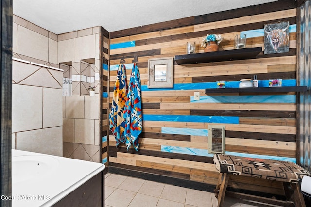 312 E 5th Ave, Clark Fork, ID 83811 - full bathroom featuring wooden walls, tile patterned floors, and vanity
