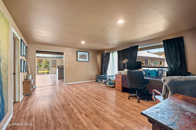 312 E 5th Ave, Clark Fork, ID 83811 - office space featuring light wood-type flooring, a textured ceiling, and recessed lighting