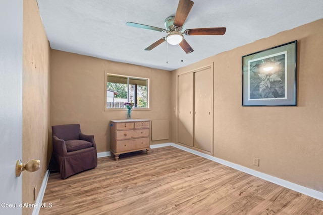 312 E 5th Ave, Clark Fork, ID 83811 - living area with wood finished floors and ceiling fan