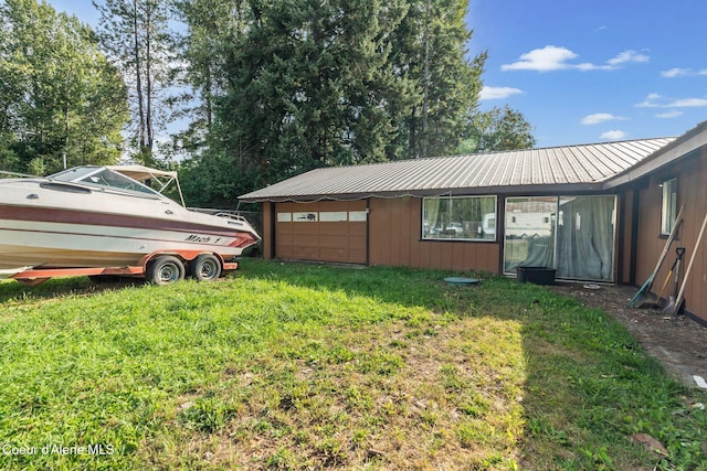 312 E 5th Ave, Clark Fork, ID 83811 - view of green lawn featuring a garage
