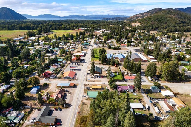 312 E 5th Ave, Clark Fork, ID 83811 - aerial overview of property's location featuring a mountainous background and nearby suburban area