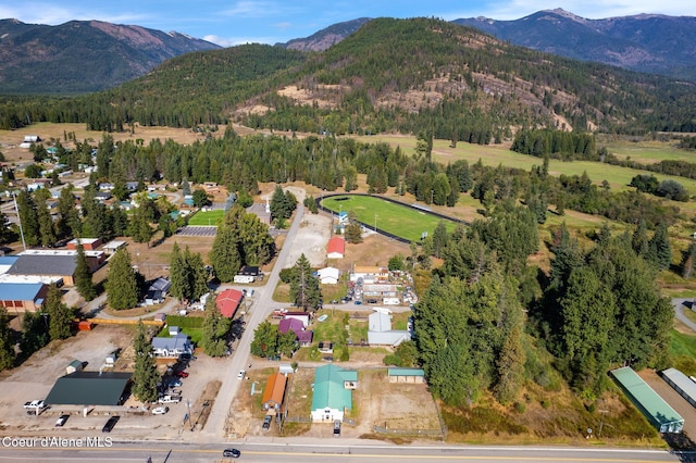 312 E 5th Ave, Clark Fork, ID 83811 - aerial view of property and surrounding area featuring a mountainous background and a heavily wooded area