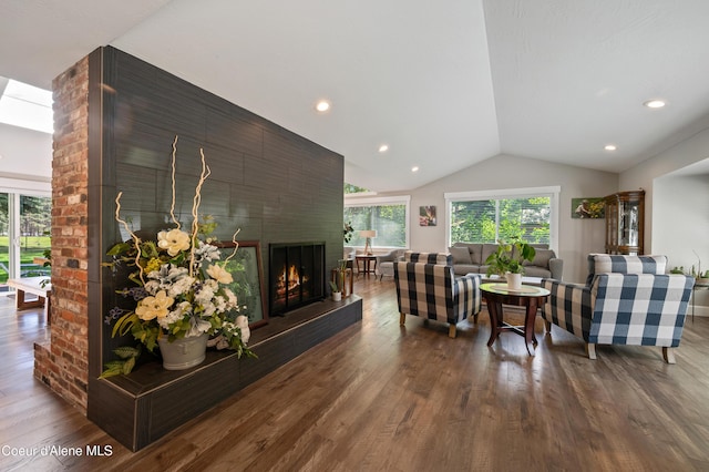 3593 W Fairway Dr, Coeur Dalene, ID 83815 - living area featuring vaulted ceiling, dark wood-style floors, a brick fireplace, and recessed lighting