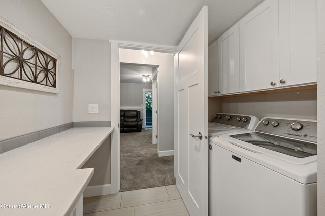 3593 W Fairway Dr, Coeur Dalene, ID 83815 - washroom with cabinet space, separate washer and dryer, light colored carpet, and light tile patterned floors