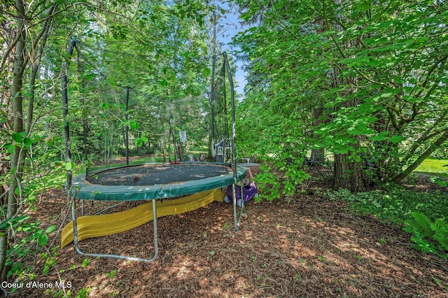 3593 W Fairway Dr, Coeur Dalene, ID 83815 - view of yard with a trampoline