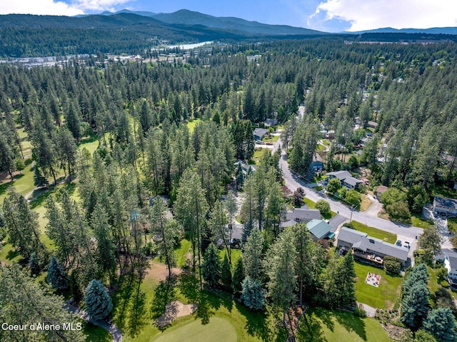 3593 W Fairway Dr, Coeur Dalene, ID 83815 - aerial view of property and surrounding area featuring a forest and a mountain backdrop