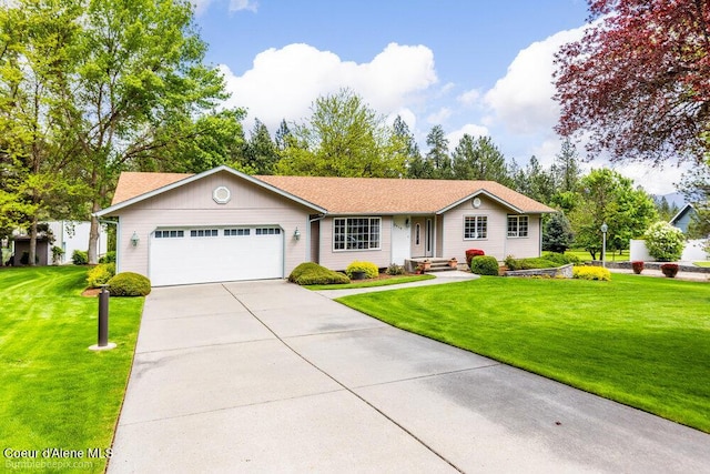 8416 N Haye Ln, Newman Lake, WA 99025 - single story home featuring an attached garage, concrete driveway, and a front yard