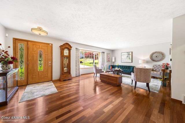 8416 N Haye Ln, Newman Lake, WA 99025 - foyer with a textured ceiling, wood finished floors, and baseboards