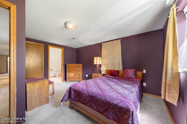 8416 N Haye Ln, Newman Lake, WA 99025 - bedroom featuring carpet floors, a textured ceiling, ensuite bathroom, and baseboards
