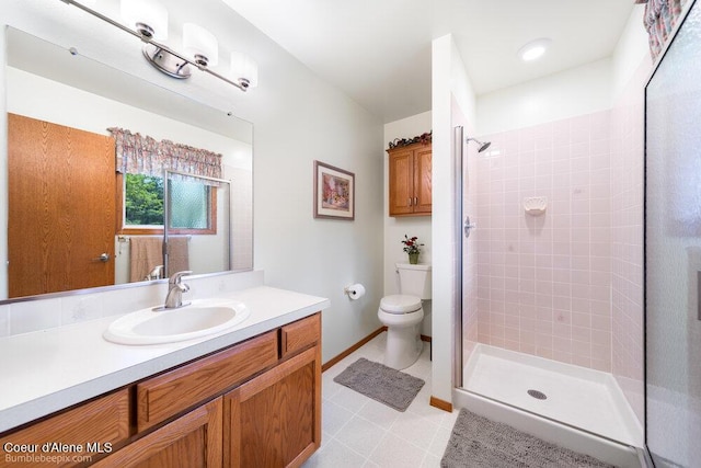 8416 N Haye Ln, Newman Lake, WA 99025 - full bath with a shower stall, vanity, toilet, and tile patterned flooring