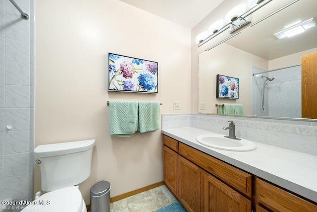 8416 N Haye Ln, Newman Lake, WA 99025 - full bathroom featuring vanity, toilet, a shower, baseboards, and tasteful backsplash